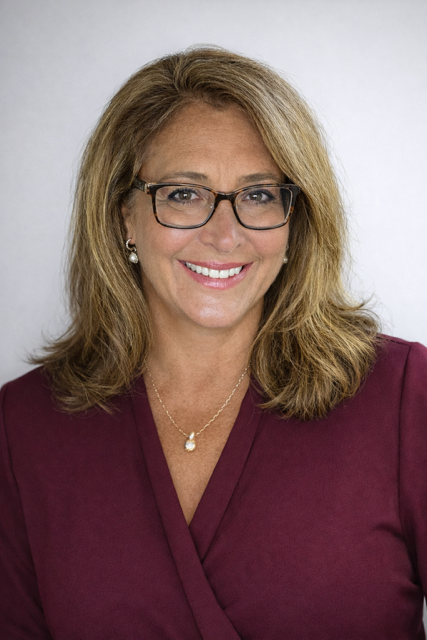 Professional headshot of Megan Donahue, RE/MAX Eagle Realty